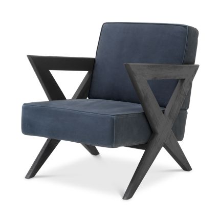 Eichholtz vintage blue velvet armchair with black x-shaped legs