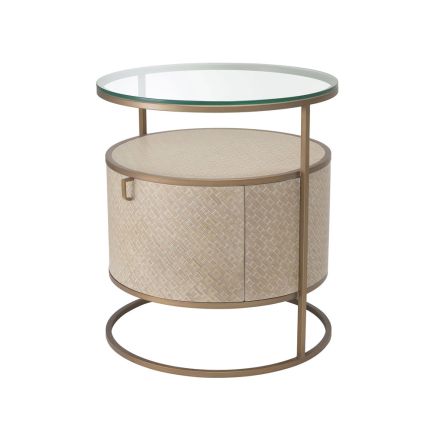A chic washed oak bedside table with a brushed brass structure and clear glass tabletop