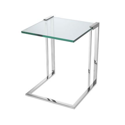 An elegant side table with a thick clear glass top and polished stainless steel frame
