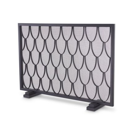 A black fire screen by Eichholtz with a scaled pattern and a close-meshed grille