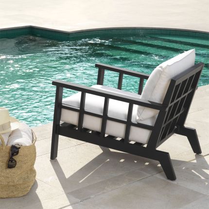 Contemporary luxe black outdoor armchair with natural seat cushion by Eichholtz