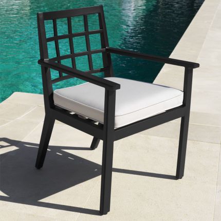 Sleek black outdoor dining chair with natural seat cushion by Eichholtz
