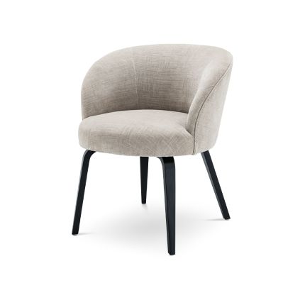 A stylish dining chair by Eichholtz with a beige upholstery, curved back and black tapered legs