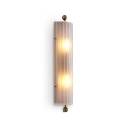 A delicate frosted glass wall lamp with antique brass details