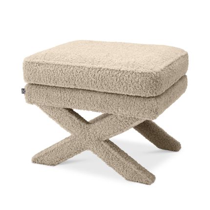A stunning fluffy brown ottoman with x-shaped legs 