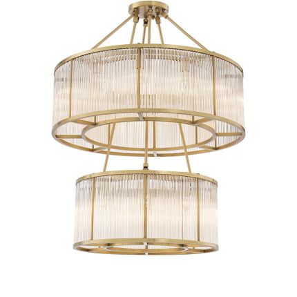 A decadent two-tiered chandelier with panelled glass and brass accents