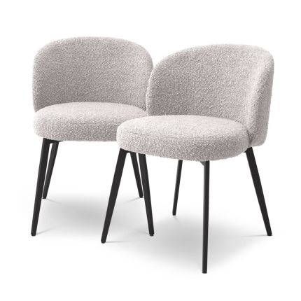 A beautiful set of dining chairs with a gorgeous grey boucle upholstery and black tapered legs 