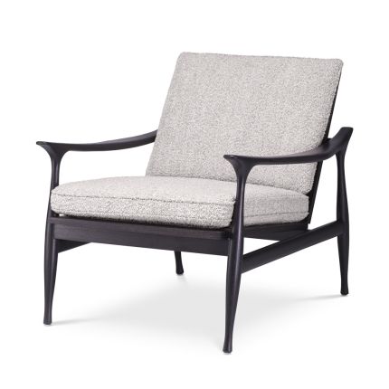 A contemporary chair by Eichholtz with a black finished wooden frame and a beautiful boucle grey upholstery 