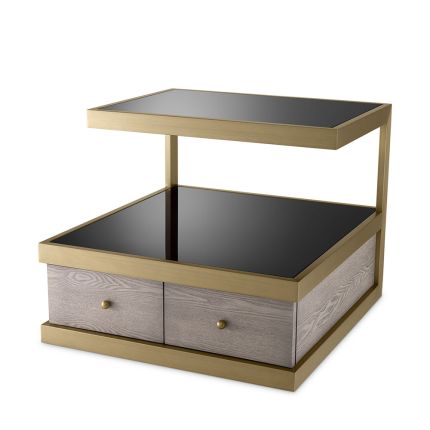 A sophisticated side table by Eichholtz which doubles up as a stylish storage solution with a brass frame and black glass finish