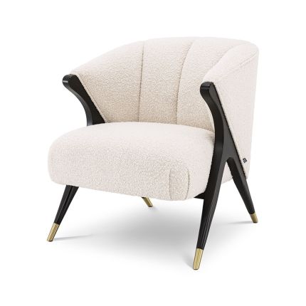 Striking and sumptuous armchair with y shaped frame and brass-capped feet