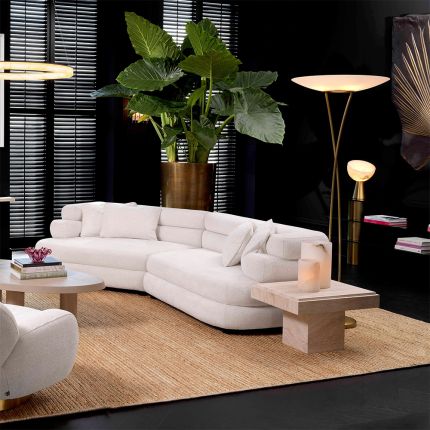 A contemporary sofa by Eichholtz with sumptuously soft curves and a luxury Lyssa Off-White upholstery