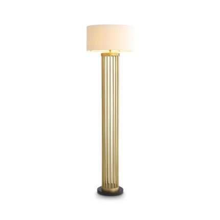 A stylish floor lamp by Eichholtz with a marble base, antique brass structure and finished with a contemporary boucle shade
