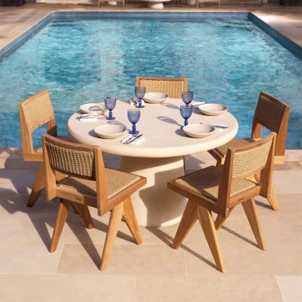 Round concrete dining table in cream for outdoor spaces