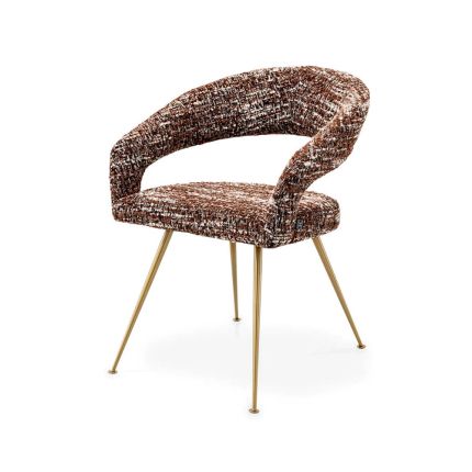 A stylish dining chair by Eichholtz with an open back and statement upholstery
