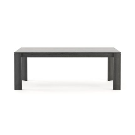 A luxurious, sculptural extendable dining table in a matte grey eucalyptus finish