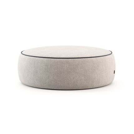 Large round pouffe in a smooth grey fabric and black piping. Pictured in Vienna Elephant.