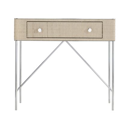 A chic and contemporary bedside table featuring a woven bleached raffia wrapped drawer box and finished with a polished stainless steel top and base