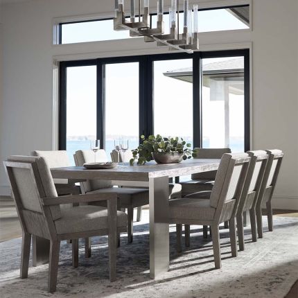 French-inspired dining table with steel legs and wooden top.