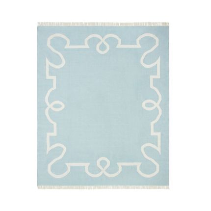 Delicate blue rug with chic border design