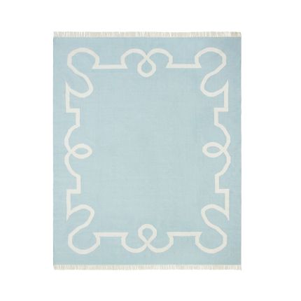 Delicate blue rug with chic border design