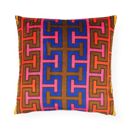Extravagant graphic print velvet cushion with bold blue, red and brown tones