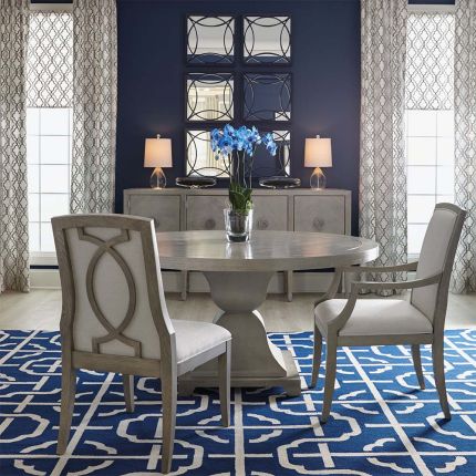 Circular dining table in a two toned wood