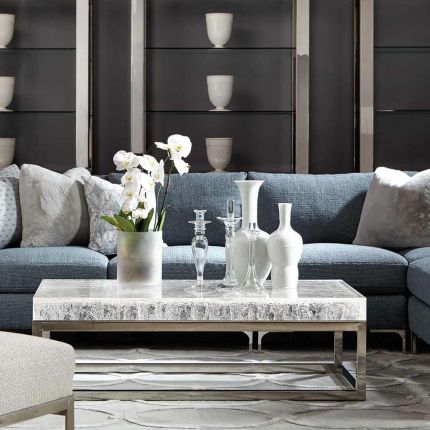 an acrylic coffee table with a cast wood grain