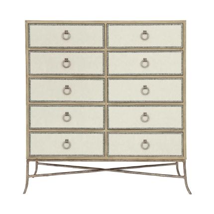 A ten drawer tallboy with upholstered drawer panels in a performance fabric and a sand finish