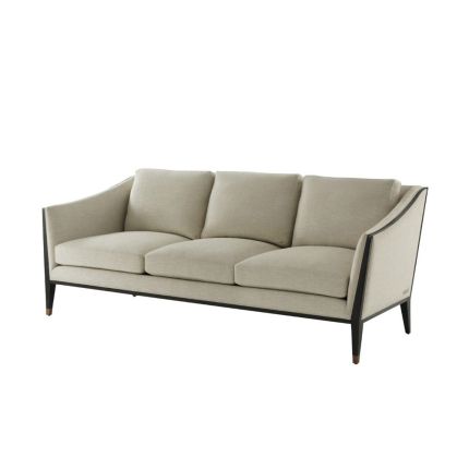 Sleek and sumptuous three seter sofa with dark outline