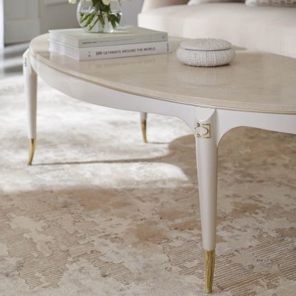 oval coffee table with golden detailings