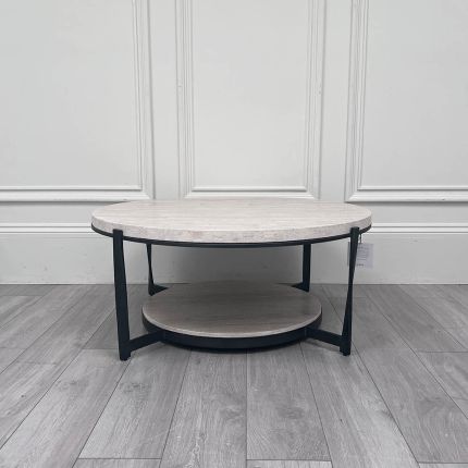 Large concrete circular coffee table with metal legs and additional storage