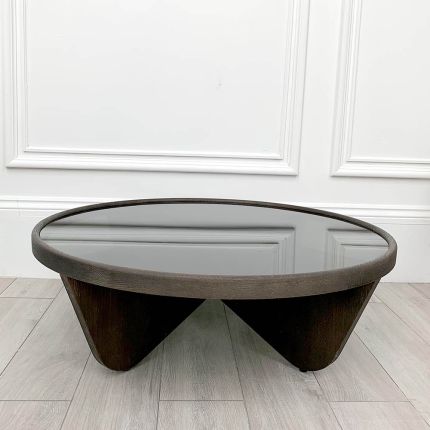 Elegant round coffee table with smoked glass table top