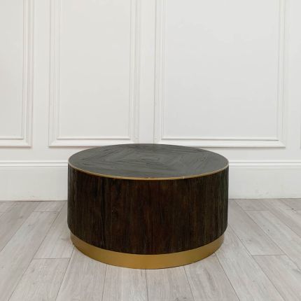 Striking round wooden coffee table with brass accents and some imperfections to the finish