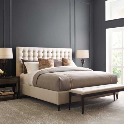 Deluxe upholstered kingsize bed with deep buttoning detail on the headboard
