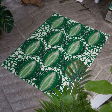 Beautiful green rug with intricate patterning details
