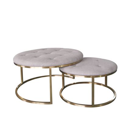 Set of two sumptuous pouffes in pale grey linen upholstery with deep buttoning on the top and a brass frame