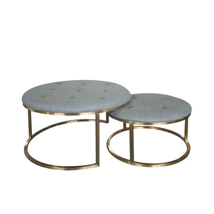Sumptuous pouffe seating with deep buttoning and brass base frame