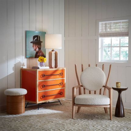 Red and orange chest of three drawers with rattan edges