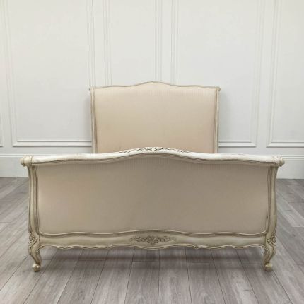 lovely french style bed with distressed finish and striped cotton upholstery