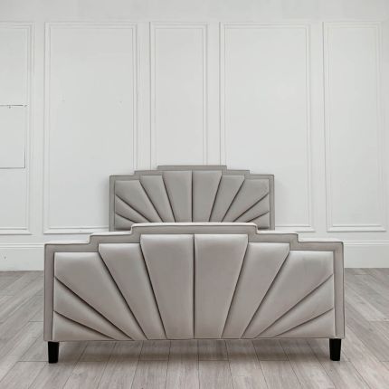 Glamorous, art-deco inspired bed upholstered in luxurious light grey velvet