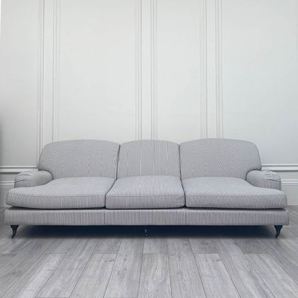 The elegant, classic shape sofa with gentle striped upholstery