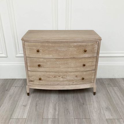 A stunning natural whitewash oak three-drawer chest with brass details