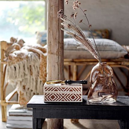 reddish brown storage box with white geometric pattern