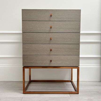 A luxurious modern 5-drawer tallboy with copper accents and base