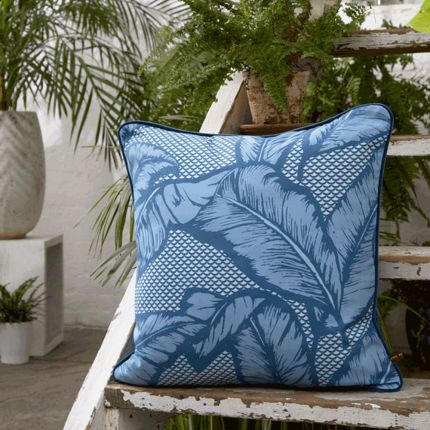 Enchanting blue cushion with large leaf design and velvet piping