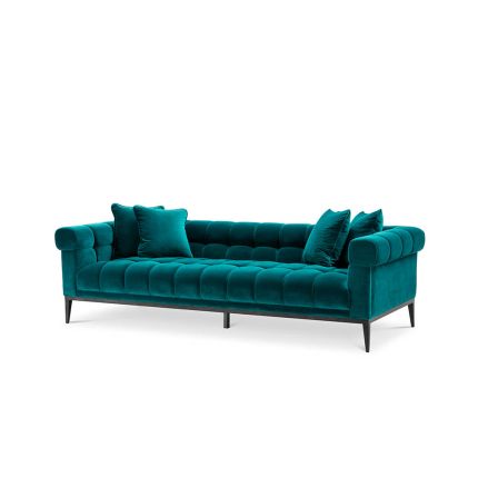 A fabulously sumptuous upholstered sofa with deep-buttoning