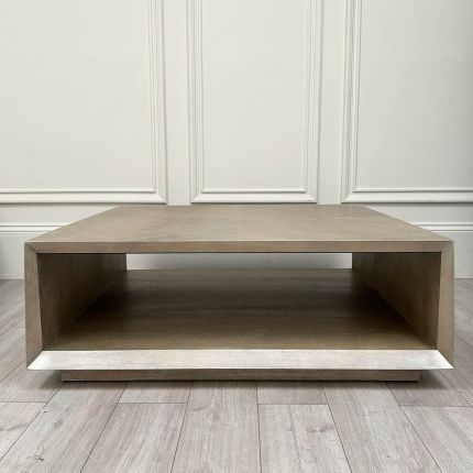 Rectangular coffee table with alternating cross pattern and open storage area 
