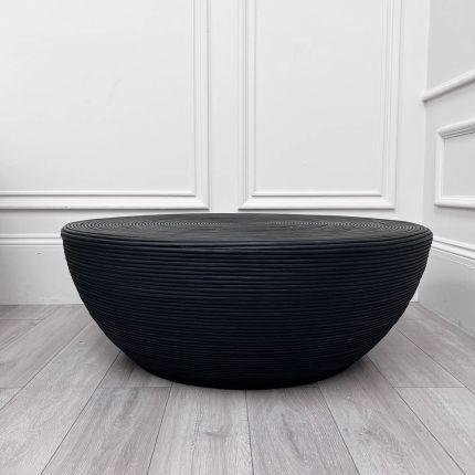 Round black coffee table with ribbed texture