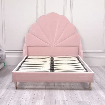Gorgeous, statement kingsize bed with rounded, fluted headboard and blossom-coloured upholstery