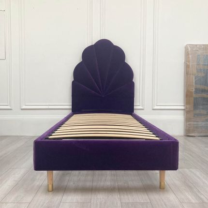 Luxurious purple ariel bed with striking headboard detail